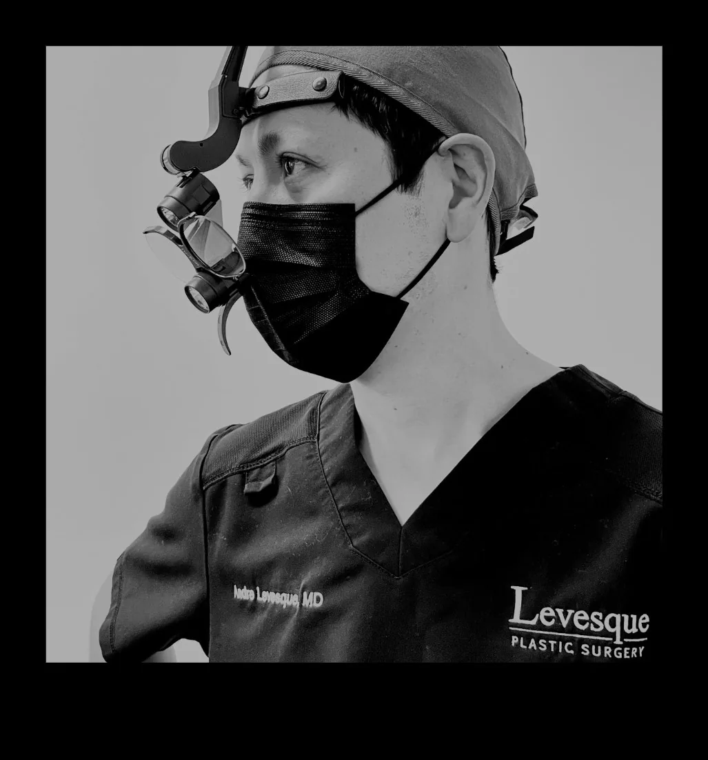 Dr. Andre Levesque, board-certified plastic surgeon in surgical loupes — Levesque Plastic Surgery, Austin TX
